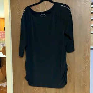 Black top with zippers and slight ruching.